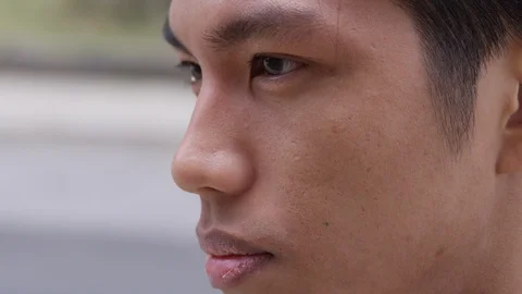 Extreme close up young man contemplating his future. - Slow Motion - shot on RED Stock Footage 125215059