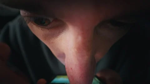 Extreme Close Up of Young Man Staring at Screen in Dark Room Late at Night Stock Footage 334130274