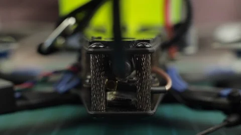 Extreme close up of young man's hands assembling FPV racing drone using Vídeo Stock 128820875