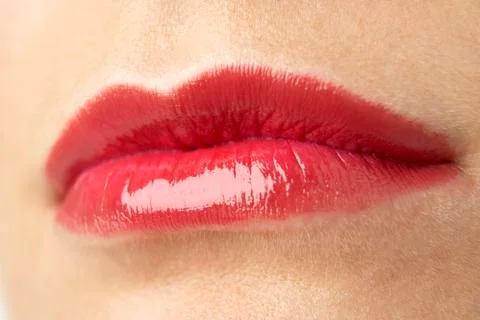 Extreme Close-Up Of Young Woman Wearing Red Lipstick Stock Photos