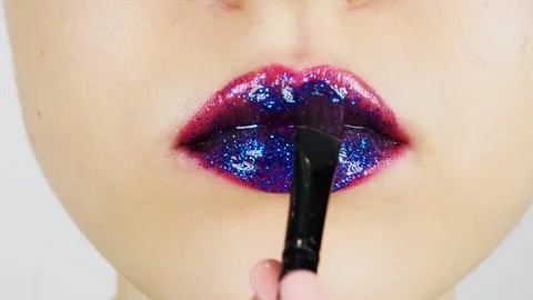 Extreme close-up of young woman's lips. 動画素材 112957654