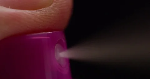 Extreme closeup of aerosol being sprayed slow motion Stock Footage 71779244