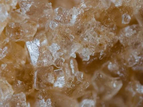 Extreme closeup of a brown sugar cube. Very shallow depth of field. Stock Photos