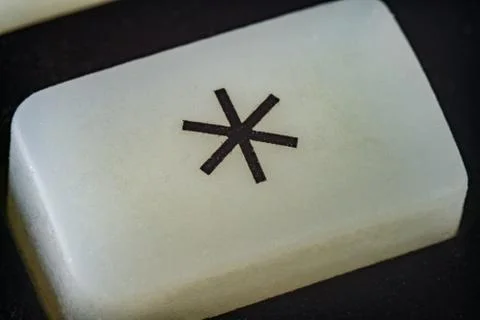 Extreme closeup of a button with number asterisk on it Stock Photos