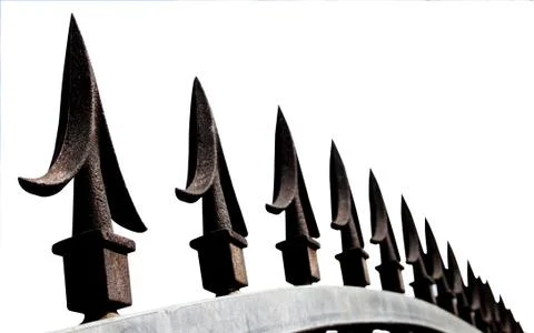 Extreme closeup of decorative security gate spikes Stock Photos