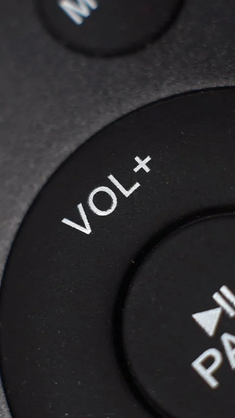 Extreme Closeup Of Finger Pressing Volume Up On Remote Control, Vertical Footage Stock Footage 340167229