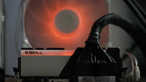 Extreme closeup on foreground of power cables and RAM memory sticks installed on Stock Footage 237914193