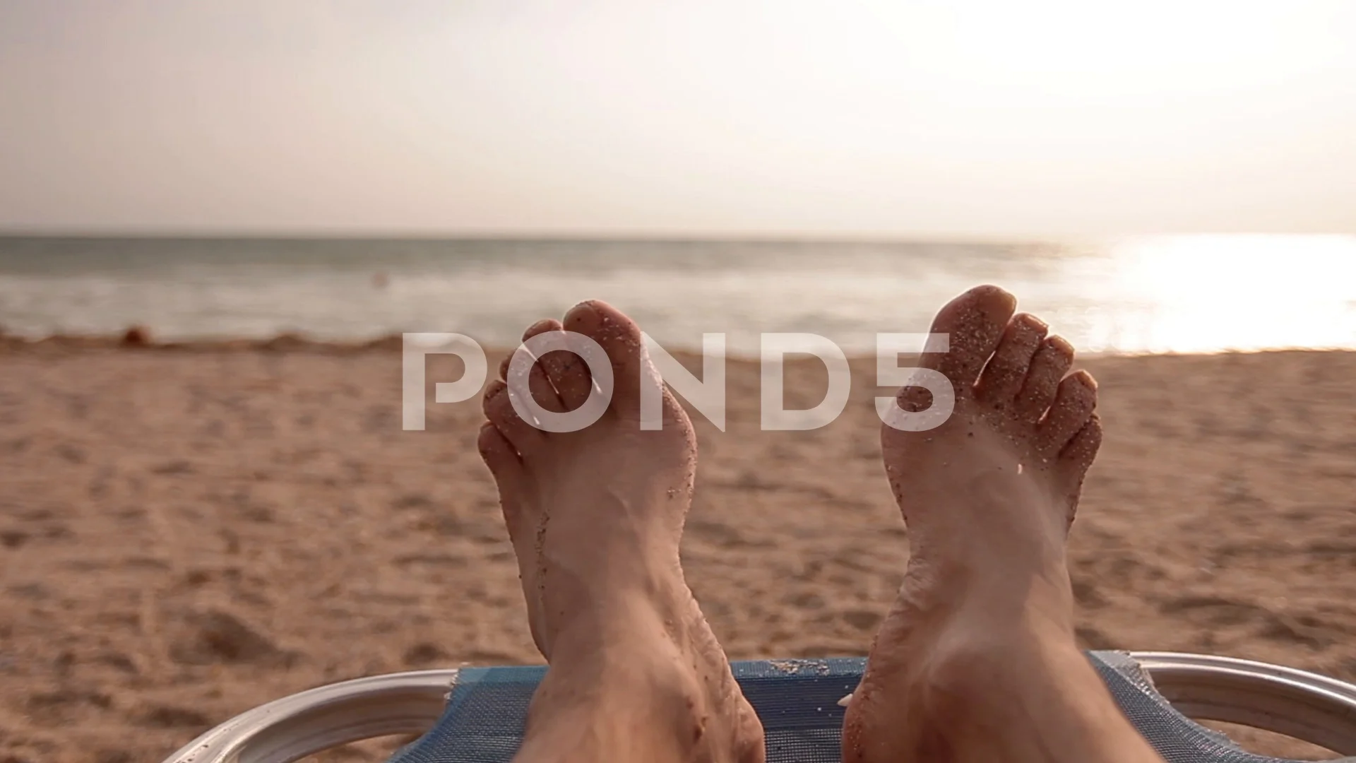 Extreme Closeup Hairy Feet of Man Sunbathing Early in the Morning Right  after