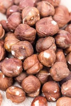 Extreme closeup macro bunch of hazelnuts background Stock Photos