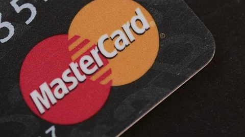 Extreme closeup macro of a Mastercard card. Consumerism or debt concept Stock Footage 164778193