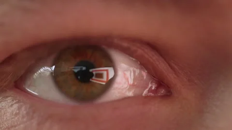 Extreme Closeup of Man's Eye Staring at Projection of Rapidly Changing, Color 動画素材 68723643