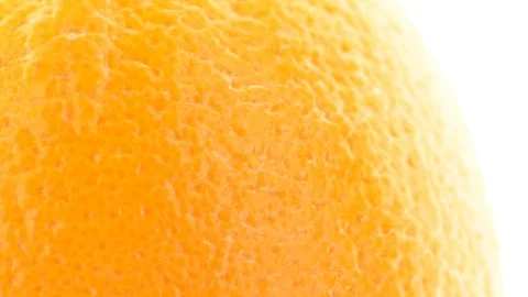 Extreme closeup of orange fruit - pan - orange peel with pores visible Stock Footage 104528399