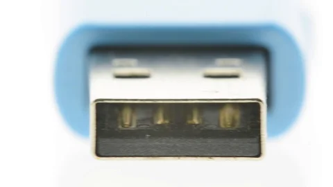 Extreme closeup pan of blue usb flash thumb drive Stock Footage 104528384
