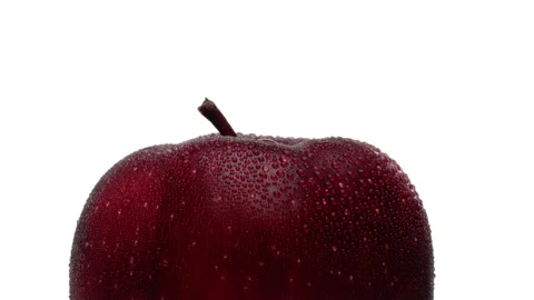 Extreme closeup of a red apple upper part. Rotating. Isolated on white Stock Footage 169752444