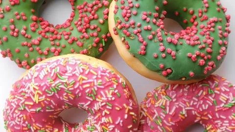 Extreme closeup rotation of appetizing fresh doughnuts composition ready for Video stock 153308664