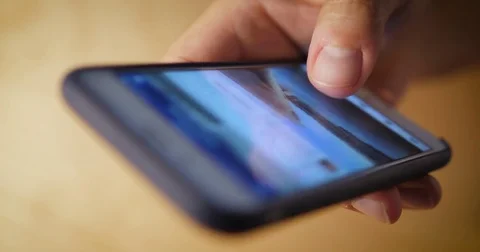 Extreme Closeup Scrolling Social Media on Touchscreen Smartphone Stock Footage