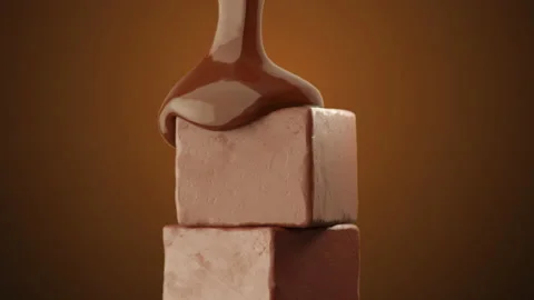 Extreme Closeup slow motion Chocolate pouring on chocolate cube. Stock Footage 205819357