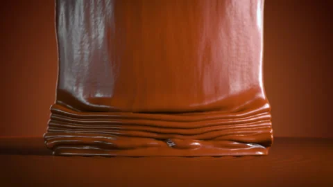 Extreme Closeup Slow motion Chocolate Liquid Pouring drip on top. Stock Footage 284808384