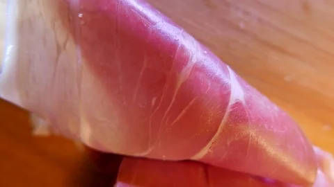 Extreme closeup of thin slices of delicious pork ham on the dish. 4K UHD 動画素材 73047802