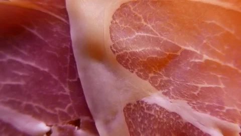 Extreme closeup of thin slices of delicious pork ham on the dish. 4K UHD Vídeo Stock 73048199