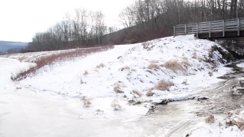 Extreme cold river park hand held video Stock Footage 262378934
