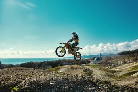 Extreme concept, challenge yourself. Extreme jump on a motorcycle on a Stock Photos