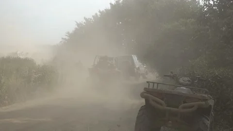 Extreme conditions for driving. A cloud of dust from wheels of cars Stock Footage 157692255