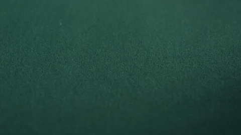 Extreme CU of pair of deuces being dropped on green felt table Stock Footage 53239998