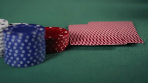 Extreme CU of player lifting edge of cards up, revealing a pair of aces and bets Stock Footage 53238597