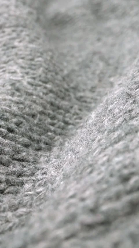 Extreme detail view of sheep wool cloth texture flowing in macro dolly shot. Stock Footage 293409978