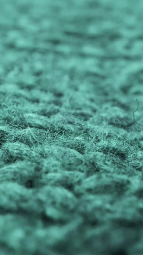 Extreme detail view of sheep wool cloth texture flowing in macro dolly shot. Stock Footage 294729640