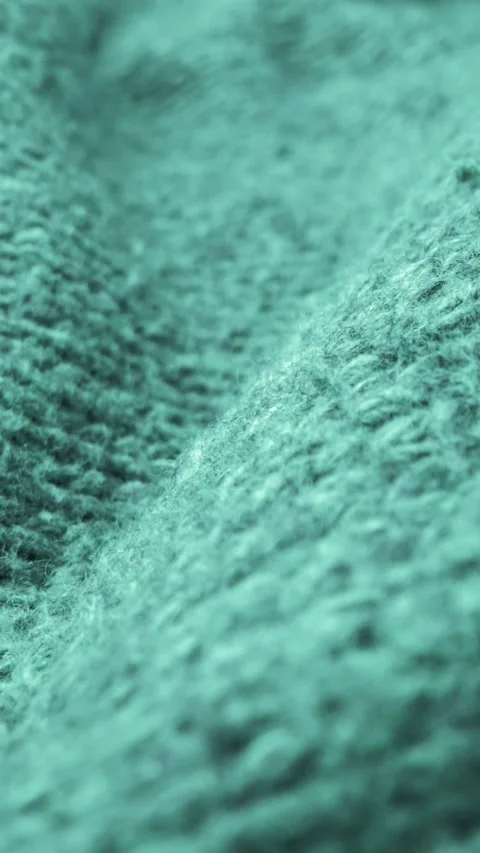 Extreme detail view of sheep wool cloth texture flowing in macro dolly shot. Stock Footage 295242592