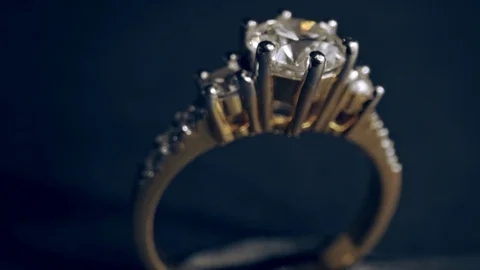 Extreme detailed of diamond ring close up shot while rotating on dark background Stock Footage 129093812