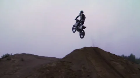 Extreme dirt biker does big trick Stock Footage 45330799
