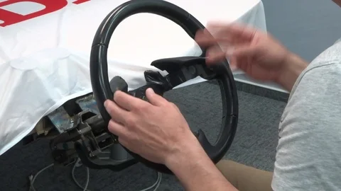Extreme driving school - learning to drive, fast steering wheel turn and rotatio Stock Footage 94771977