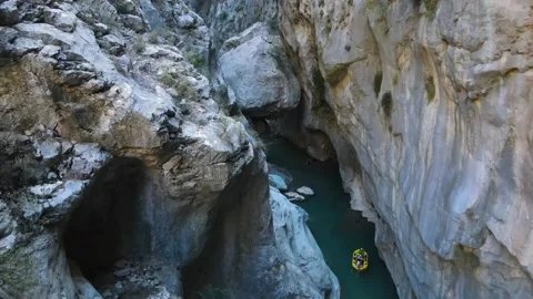 Extreme drone flight between rocks in a canyon Stock Footage 168402608