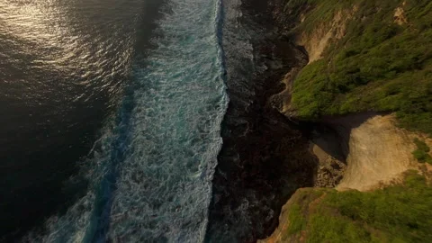 Extreme FPV Drone Dive Above Karang Boma Cliff At Sunset, First Person Flight Fo Stock Footage 336636694