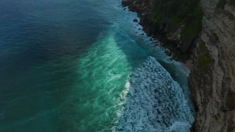 Extreme FPV Drone Dive Above Ocean Cliffs As Free Spirited Woman Spreads Arms on Stock Footage 336643510