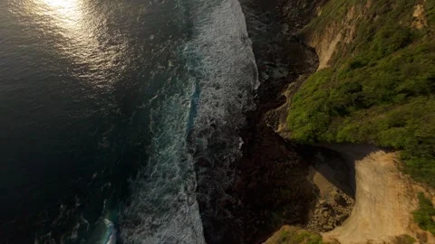Extreme FPV Drone Dive Down Karang Boma Cliff Toward Powerful Ocean Waves, First Stock Footage 336636420