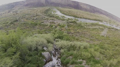 Extreme FPV Drone Waterfall Dive: Vertical Descent Over Rushing Rapids Stock Footage 331896597