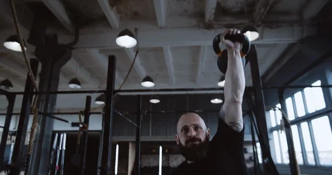 Extreme functional training, athletic young Caucasian man during workout lifting Stock Footage 116880533