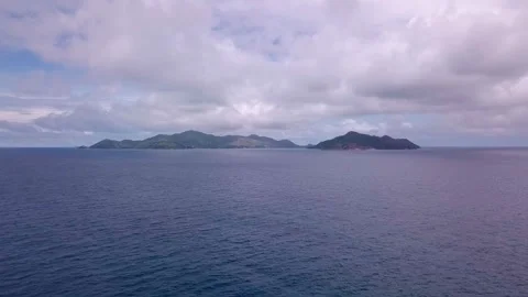Extreme long shot: looking over ocean at distant islands. HD50p Stock Footage 242016128
