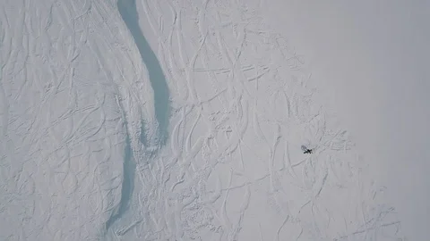 Extreme long shot top view alone professional snowboarder ride on empty track at Stock Footage 120834073