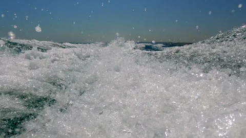 Extreme low angle pov of speed boat water wake slow motion Stock Footage 278952944