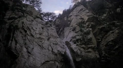 Extreme Low Angle shot of waterfall in canyon Stockbeeldmateriaal 60700335