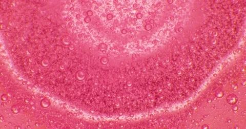 Extreme macro of bubbles in pink jello cream (gel). 4k. Stock Footage