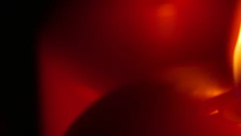 Extreme Macro close up up 3 lit red candles rotating around black background Stock Footage 70239815