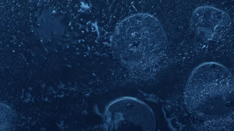 Extreme macro close-up of cracked blue melting ice texture in time lapse Stock Footage 334457383