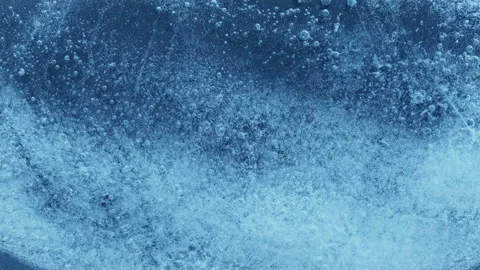 Extreme macro close-up of cracked blue melting ice texture in time lapse Stock Footage 334457846