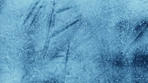 Extreme macro close-up of cracked blue melting ice texture in time lapse Stock Footage 334458370